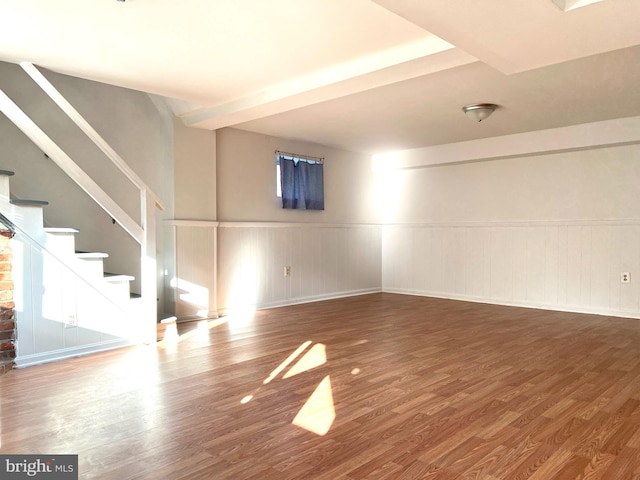 basement with hardwood / wood-style flooring