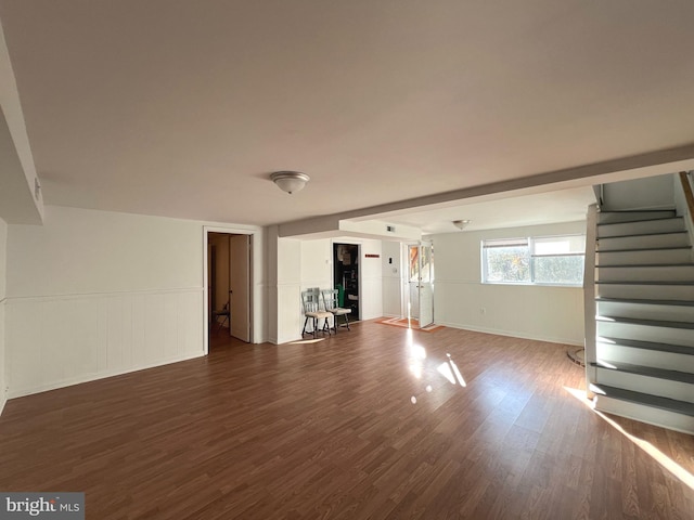 unfurnished living room with dark wood-type flooring