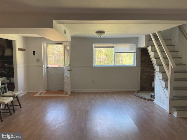 foyer entrance with dark hardwood / wood-style floors