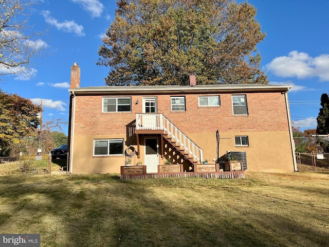 back of house with a yard