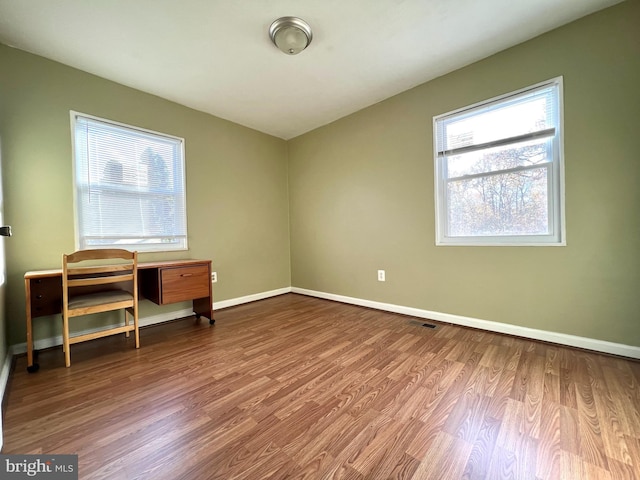 office area with hardwood / wood-style flooring