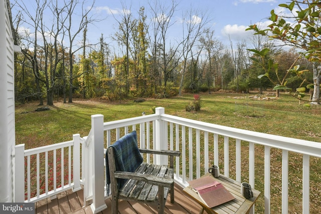 wooden terrace with a yard