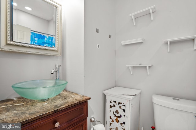 bathroom with vanity and toilet