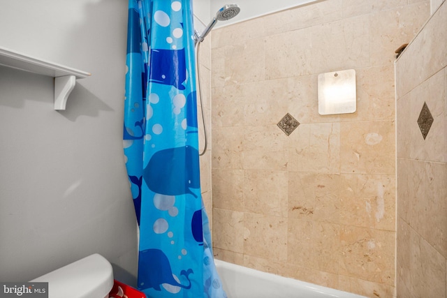 bathroom with shower / bath combination with curtain and toilet