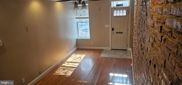 entryway featuring ceiling fan, light wood-type flooring, and a wealth of natural light