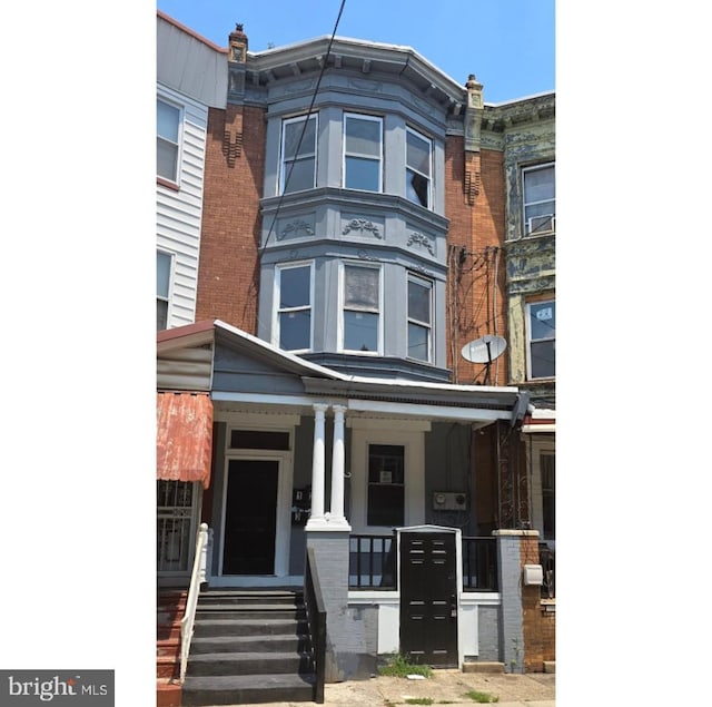 view of property with a porch