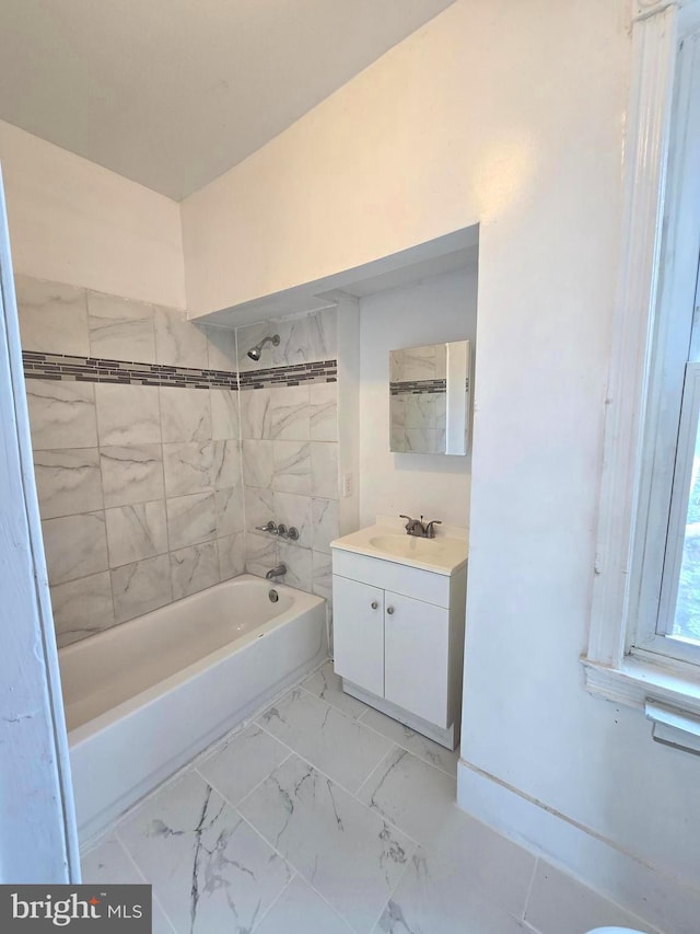 bathroom with vanity, marble finish floor, and shower / bathing tub combination