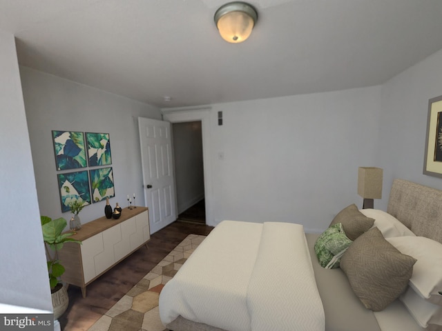 bedroom featuring dark wood-type flooring