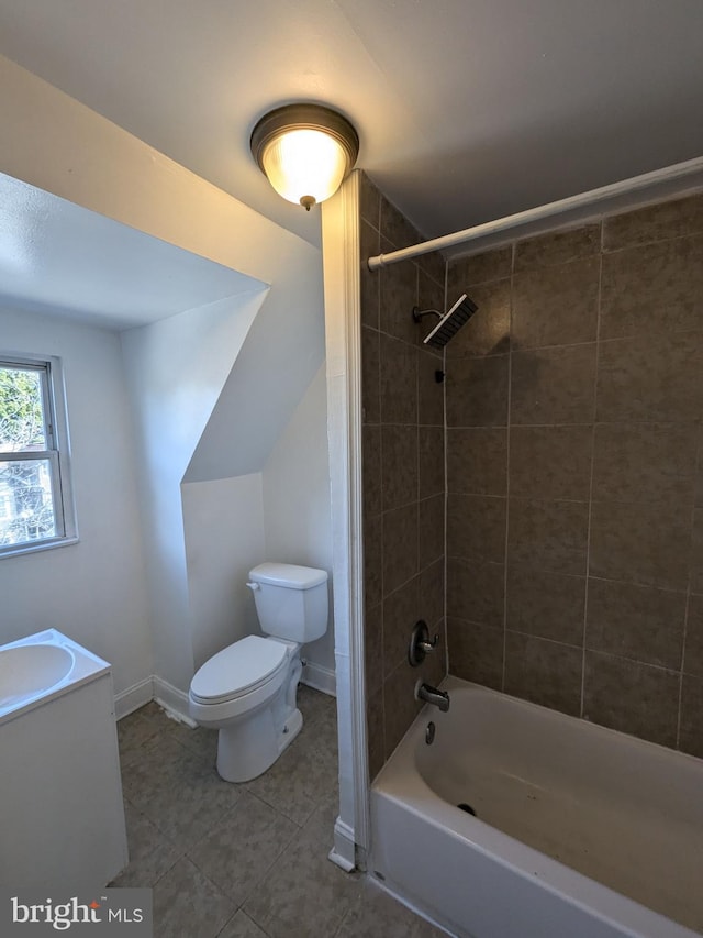 full bathroom with tiled shower / bath, toilet, and vanity