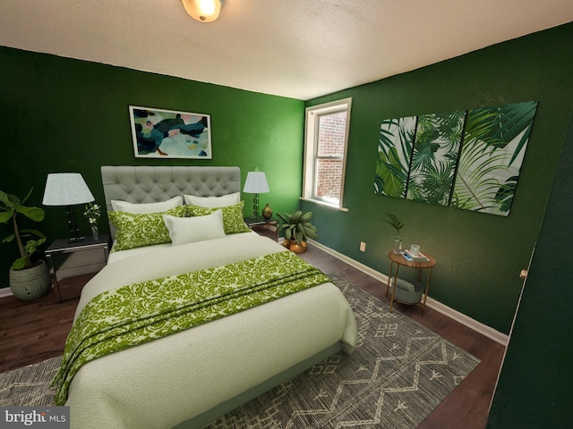 bedroom featuring dark hardwood / wood-style floors