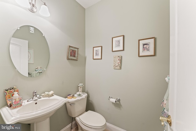 1420 N Red Maple Way, Downingtown, PA 19335 - half bathroom featuring a sink, toilet, and baseboards