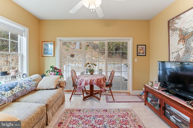 living room with light tile patterned floors and ceiling fan