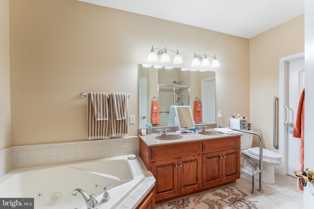 full bathroom featuring vanity, tile patterned floors, shower with separate bathtub, and toilet