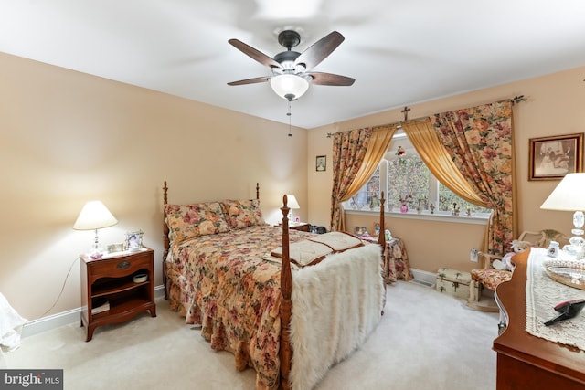 bedroom featuring light carpet and ceiling fan