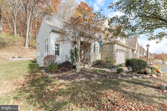 1420 N Red Maple Way, Downingtown, PA 19335 - view of front of home with a garage, stone siding, a shingled roof, and a front yard