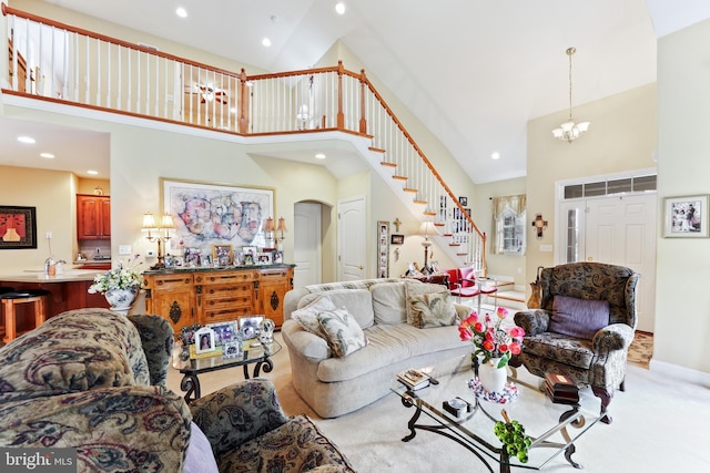 1420 N Red Maple Way, Downingtown, PA 19335 - living area with high vaulted ceiling, stairway, arched walkways, recessed lighting, and carpet