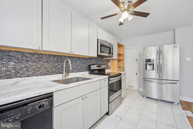 kitchen featuring stainless steel appliances, white cabinetry, and sink