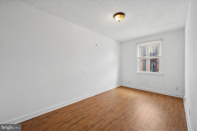 empty room featuring hardwood / wood-style floors