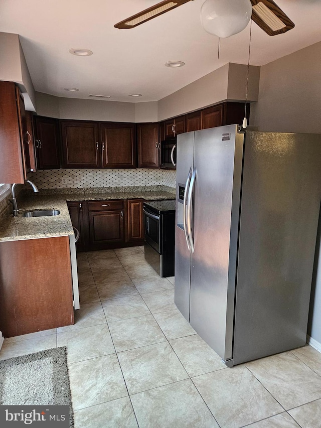 kitchen with tasteful backsplash, ceiling fan, sink, and stainless steel appliances