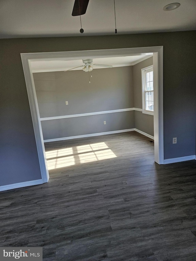 unfurnished room featuring ceiling fan and dark hardwood / wood-style floors