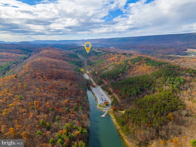 aerial view featuring a water and mountain view