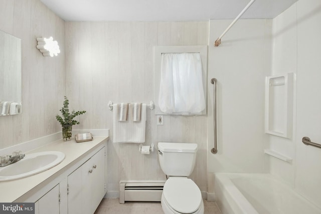 full bathroom with tile patterned flooring, a baseboard heating unit, bathing tub / shower combination, toilet, and vanity