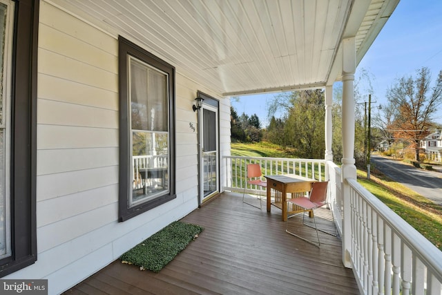 wooden terrace featuring a porch