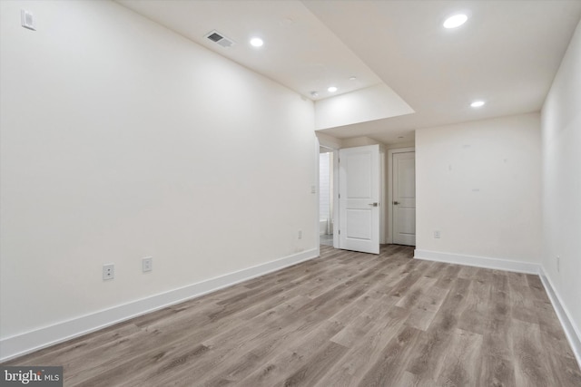 empty room with light hardwood / wood-style floors