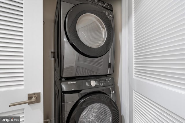 laundry area featuring stacked washer and dryer