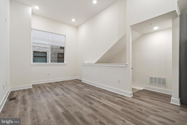 unfurnished room featuring hardwood / wood-style flooring