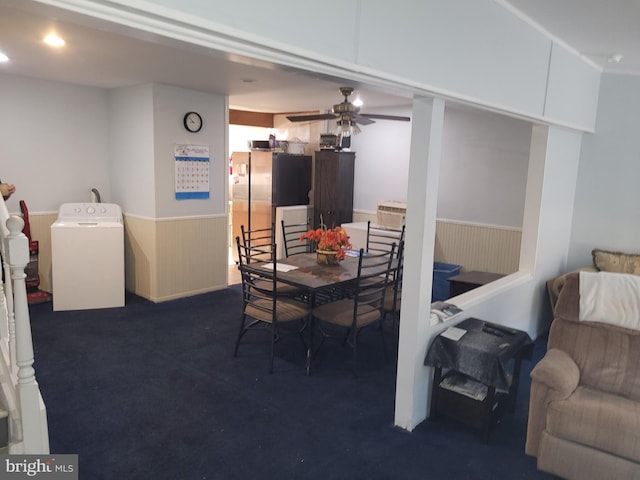 carpeted dining area with washer / dryer