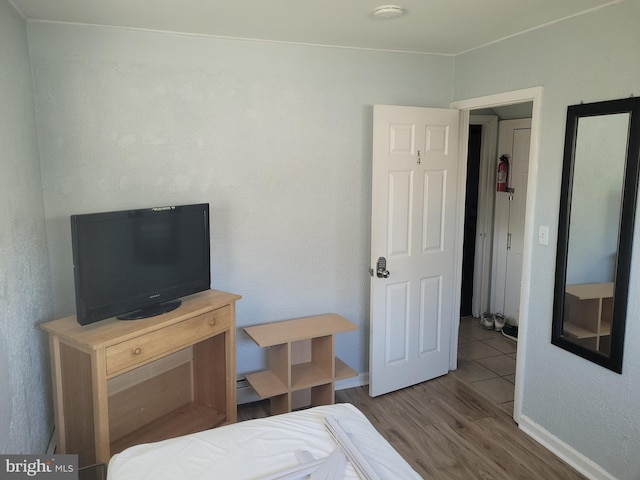 bedroom with hardwood / wood-style floors