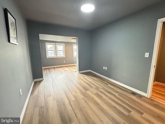 spare room featuring light hardwood / wood-style floors