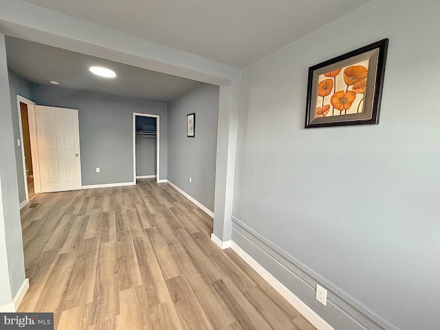 hallway with light wood-type flooring