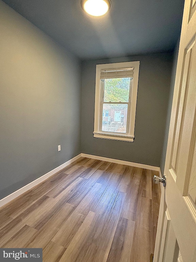 spare room featuring hardwood / wood-style floors