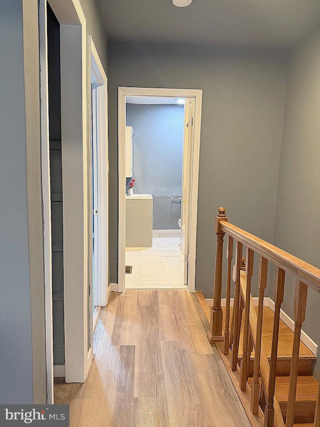 hallway with light wood-type flooring