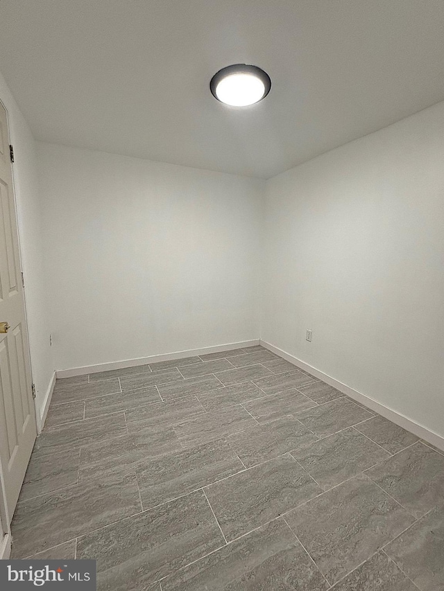 unfurnished room with hardwood / wood-style floors