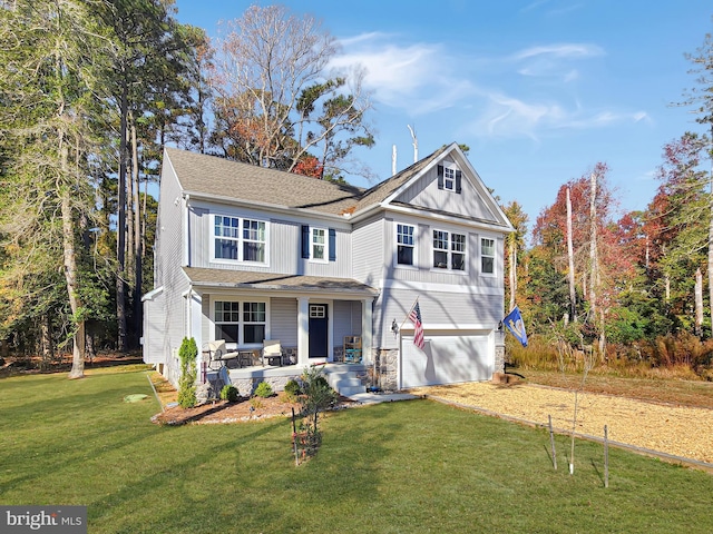 view of front of home featuring a garage and a front yard