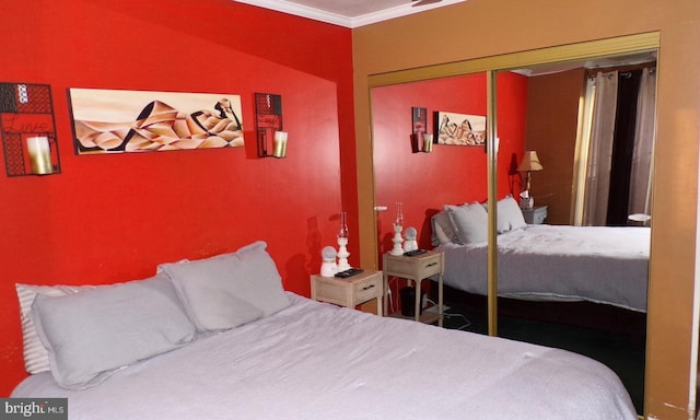 bedroom featuring a closet and ornamental molding