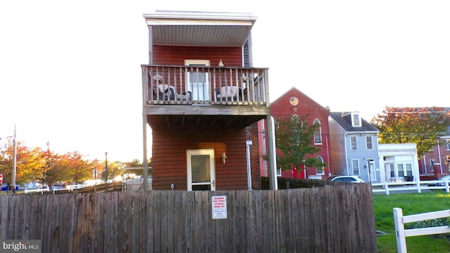 view of front of home with a balcony