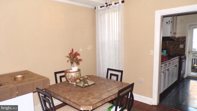 dining area featuring dark hardwood / wood-style floors