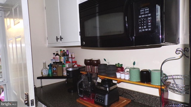 kitchen featuring white cabinetry