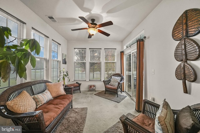 sunroom featuring ceiling fan