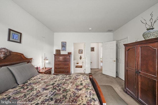 bedroom featuring light colored carpet