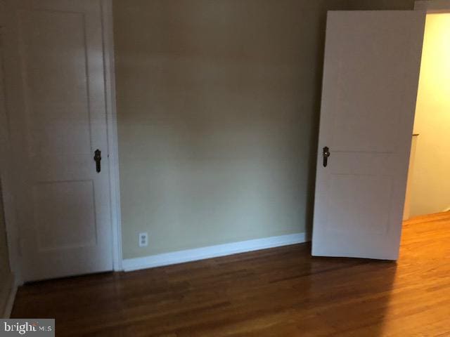 unfurnished room featuring hardwood / wood-style flooring