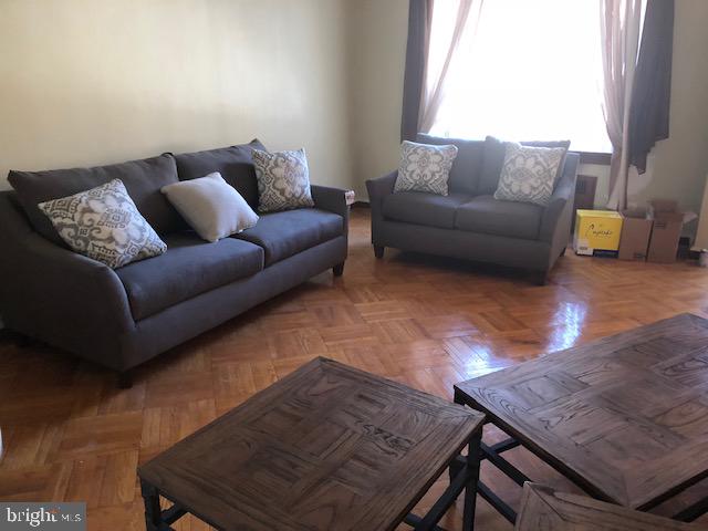 living room with parquet floors