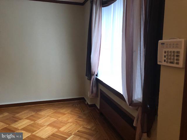 empty room featuring light parquet flooring