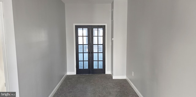 doorway to outside featuring french doors and dark carpet