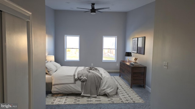 carpeted bedroom featuring ceiling fan