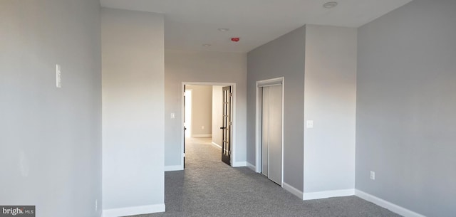 corridor with carpet flooring